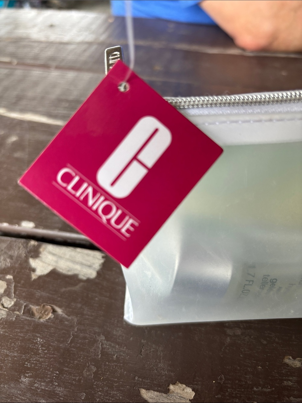 Clinique pink and white tag with frosted pouch